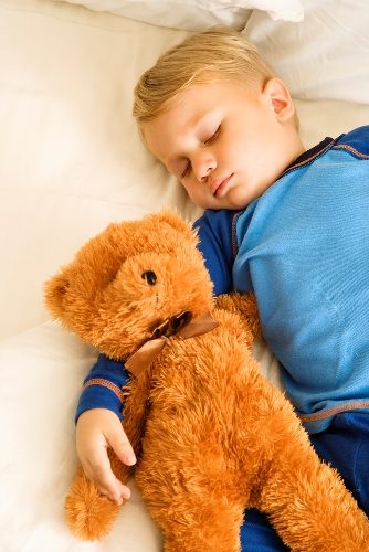 Baby sleeping with bear. Baby sleeping with bear.